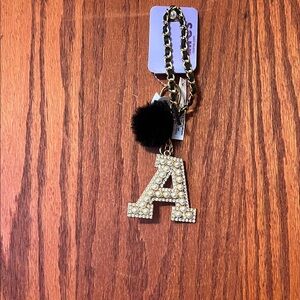 Claire's Gold Initial Keychain with Black Pom Pom